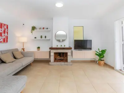 Una televisión o centro de entretenimiento en Holiday Home El Moli-3 by Interhome