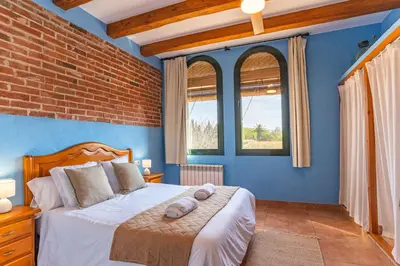 Cama o camas de una habitación en Can Pujol - Casa Rural 16-20 personas