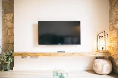 Una televisión o centro de entretenimiento en Flateli - Exclusivo Plaça Catalunya 4-1