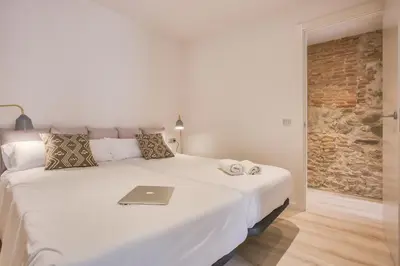 Cama o camas de una habitación en Flateli - Plaça Catalunya 22
